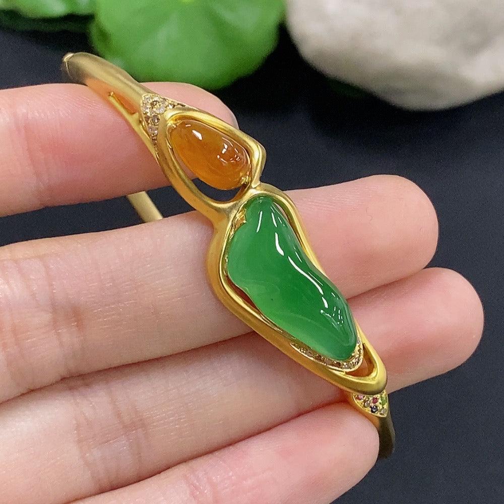 Jadeite inlaid 18k gold bangle with diamond accents, HKHQ, showing intricate design and total weight of 16.22g.
