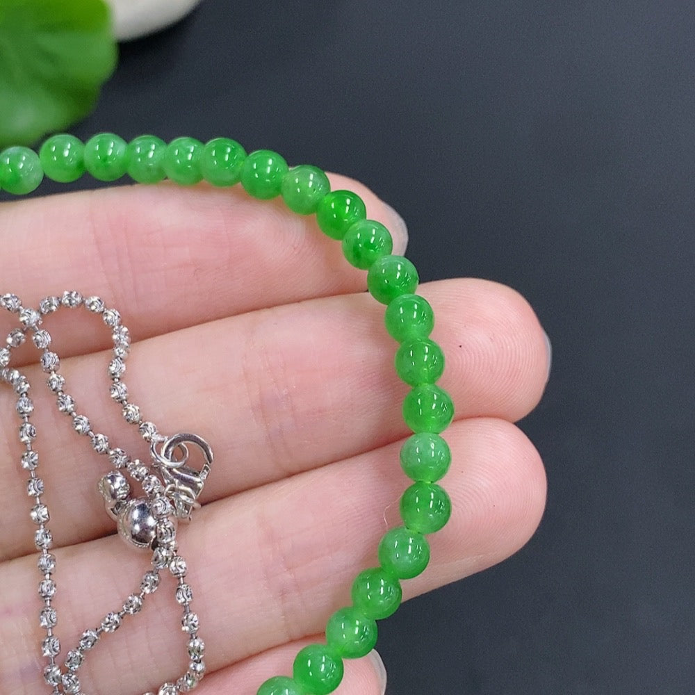 Jadeite single bezel pendant with 18k gold and diamond accents, approximately 3.9mm size, featuring a jade gemstone and chain.