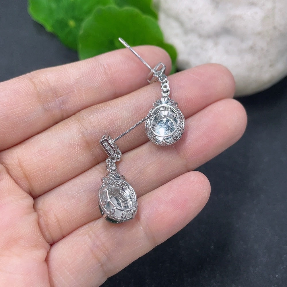 HKHQ jadeite inlaid earrings with 18K gold and diamond accents, featuring intricate craftsmanship and elegant design.