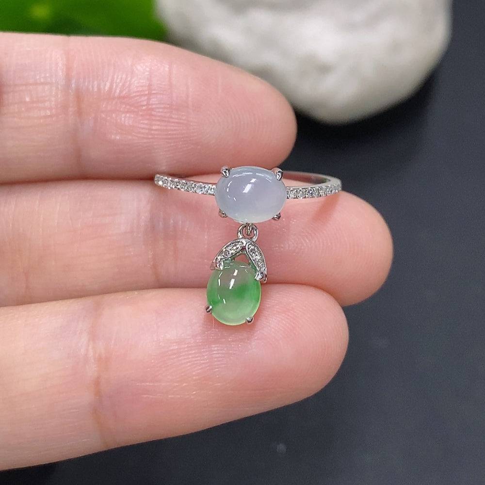 HUILIU HQ jadeite cabochon ring with diamond accents, featuring a polished jade gemstone and gold band.