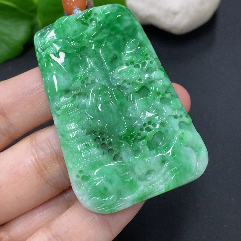 Jadeite landscape pendant by HKHQ featuring a detailed jade jade pendant with a rope, weighing approximately 32.6 grams.
