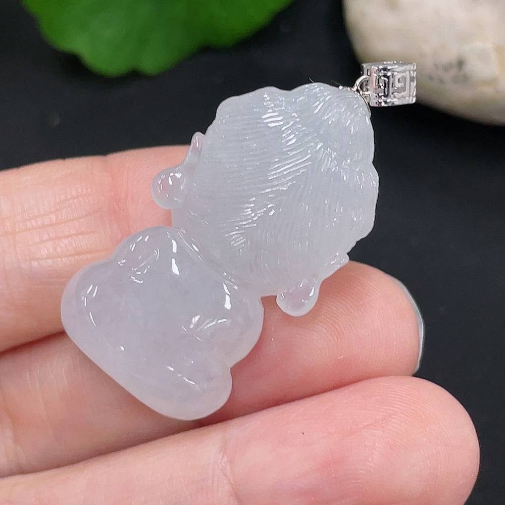 Huiliu Jadeite Guanyin pendant with intricate carving, showcasing smooth green jade craftsmanship on a plain background.