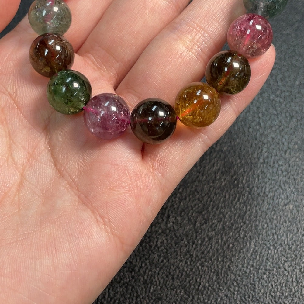 Huiliu certified tourmaline gemstone bracelet with organic matter, 11.7mm size, featuring natural textures and vibrant colors.