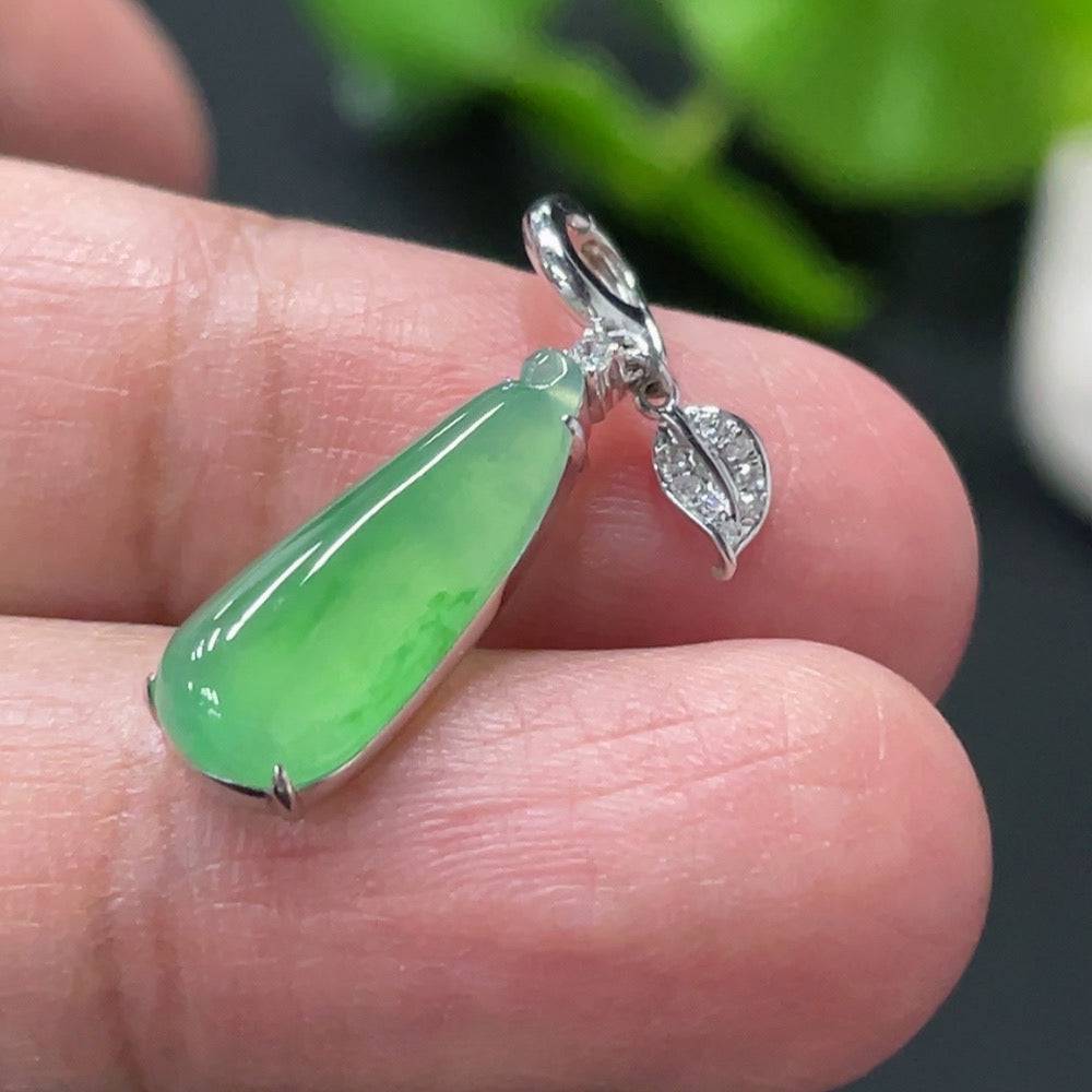 Huiliu Jadeite auspicious gourd pendant in a detailed silver setting, showcasing smooth green jade with carved design.