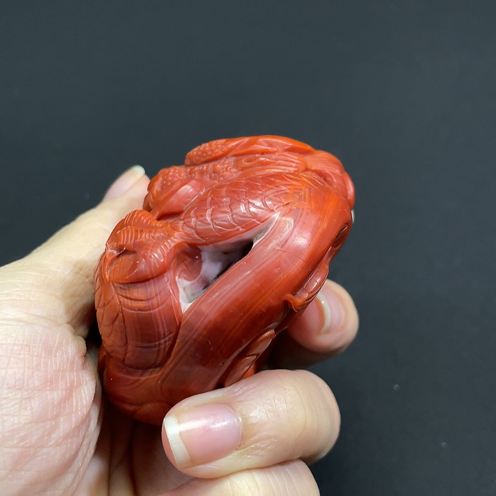 South Red Agate gemstone pendant with visible organic matter, weighs approximately 132.3g, from HKHQ, showcasing natural gemstone details.