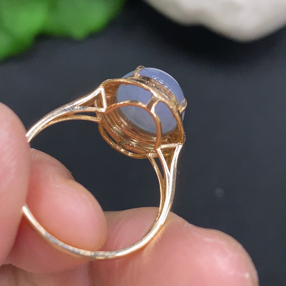 Huiliu Jadeite cabochon ring accented with diamonds, featuring a polished green jade stone on a silver band.