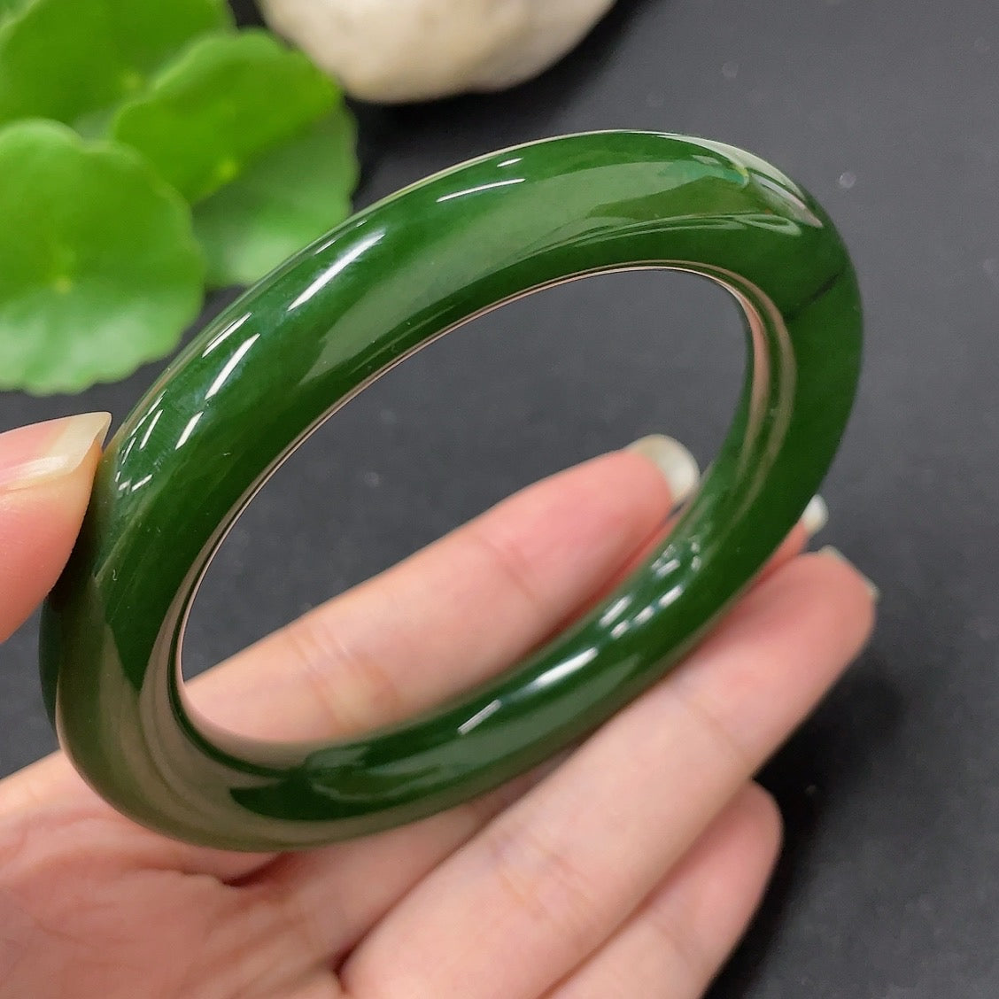 Green Hetian Jade round bangle with smooth finish, size 58.7, weighing approximately 56.9g, from HKHQ.
