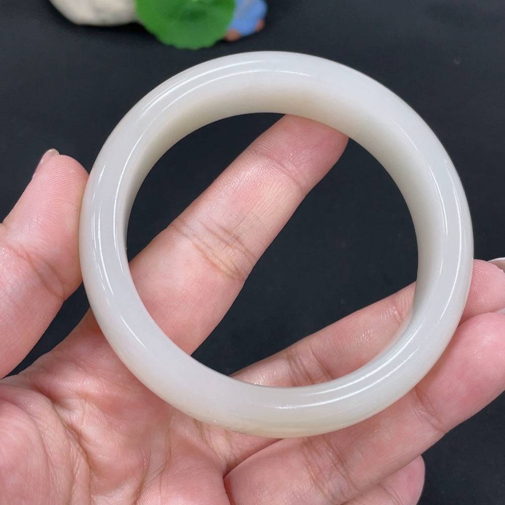 Huiliu Certified Hetian Jade round bracelet featuring smooth, polished jade beads on a delicate string.