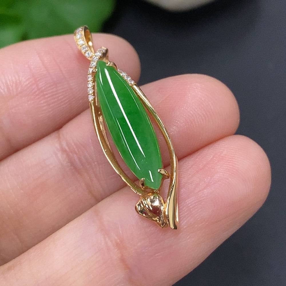 Jadeite pendant with 18K gold mount and diamond accents, showcasing a polished jade stone and elegant jewelry design.
