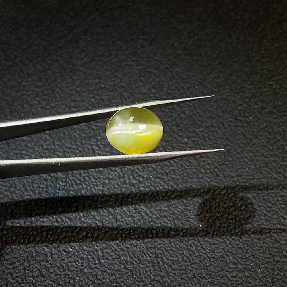 Huiliu certified chrysoberyl loose gemstone, 6.96 carats, showcasing a vibrant, transparent green gemstone with natural clarity.