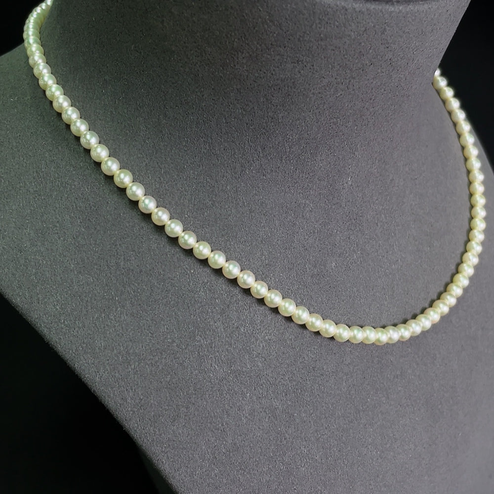 HKHQ seawater pearl strand with 4-4.4mm non-gold pearls, approximately 12.04g, showcasing the lustrous pearl necklace.