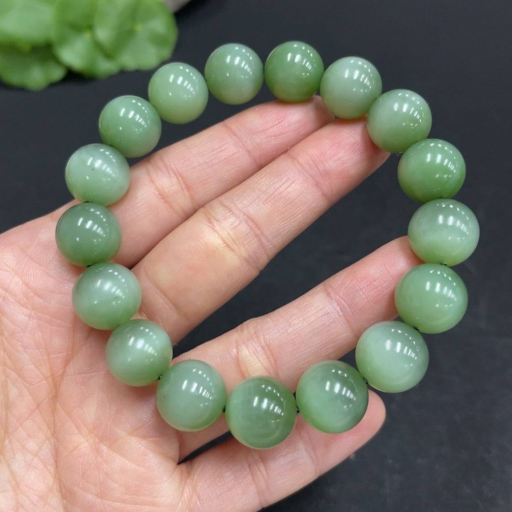 Hetian Jade Jasper bracelet with 11.7mm beads, weighing 44.6g, showcasing smooth, polished jade stones from HUILIU HQ.