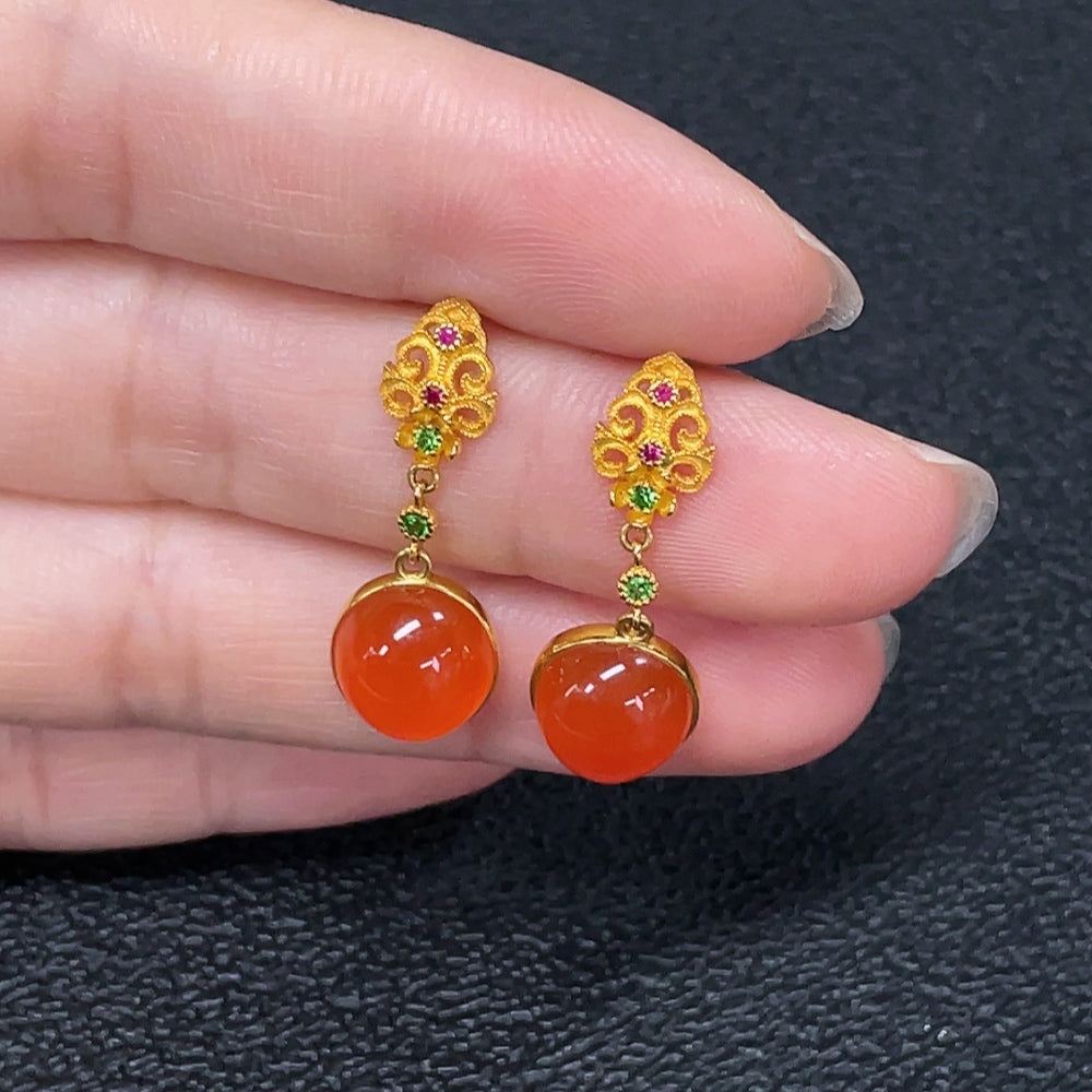 Red agate gemstone earrings with 18K gold hooks, featuring non-natural accent stones and a total weight of 2.95 grams.