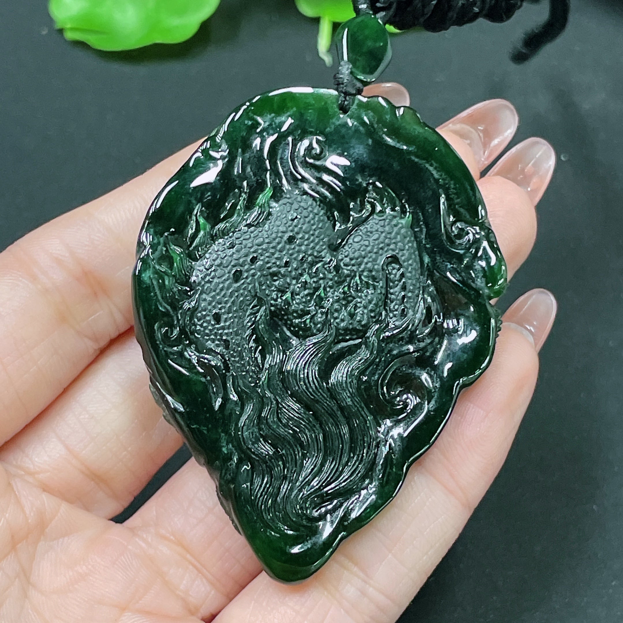 Jadeite pendant featuring a dragon plaque with intricate detailing, weighing approximately 49.58g, crafted by HUILIU HQ.