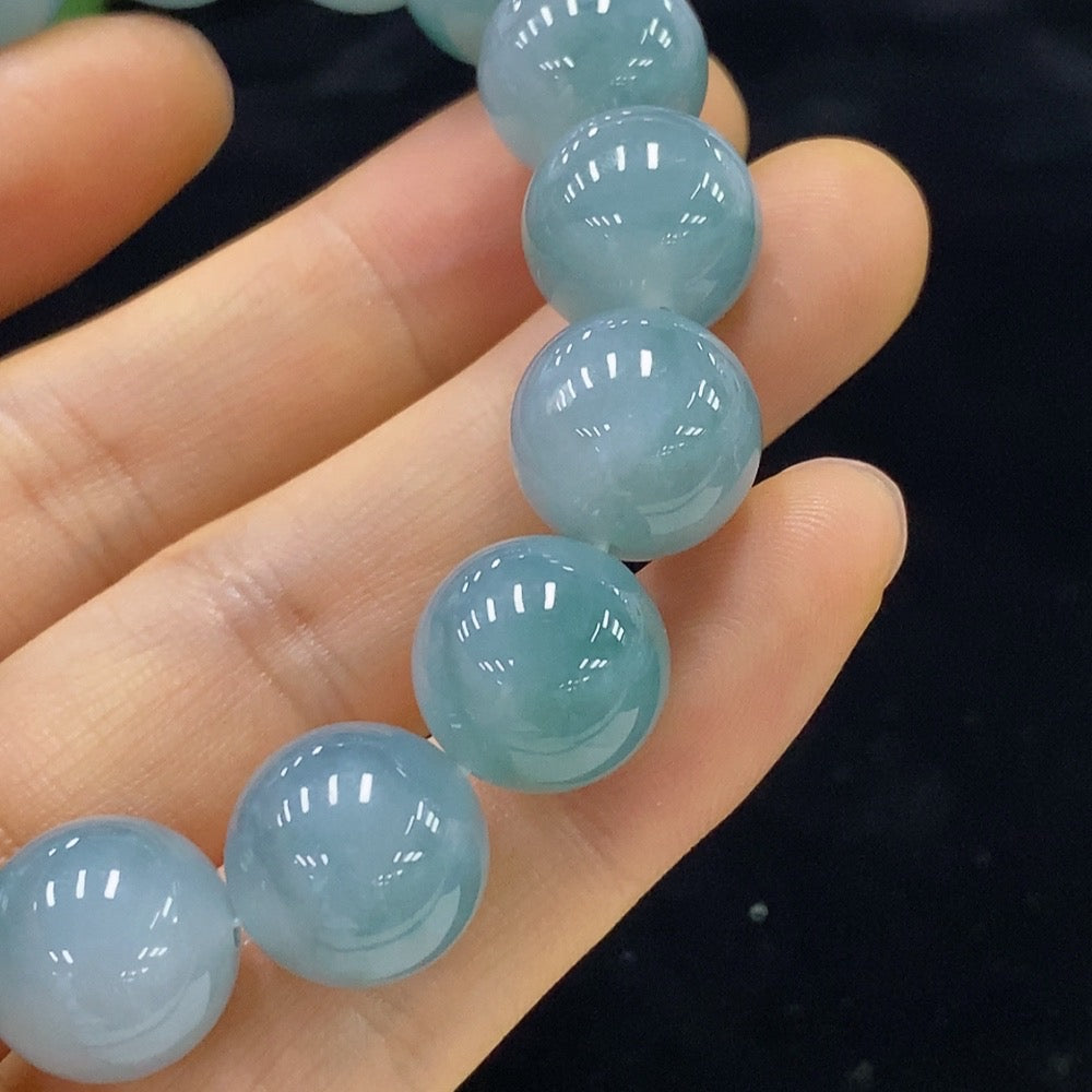 Jadeite bracelet with 12.5mm beads from HUILIU HQ, showing polished green jade beads and overall weight of 54.9g.