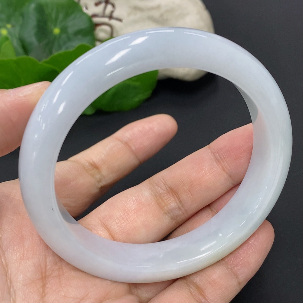 Huiliu Certified Jadeite round bangle showcasing smooth, polished jade surface with subtle green hues and a sleek circular design