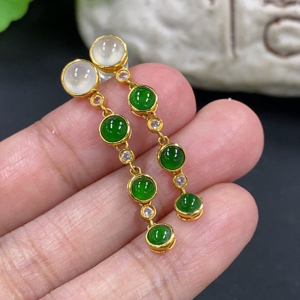 HKHQ jadeite cabochon earrings in 18K gold featuring smooth, polished jadeite stones on elegant gold hooks.