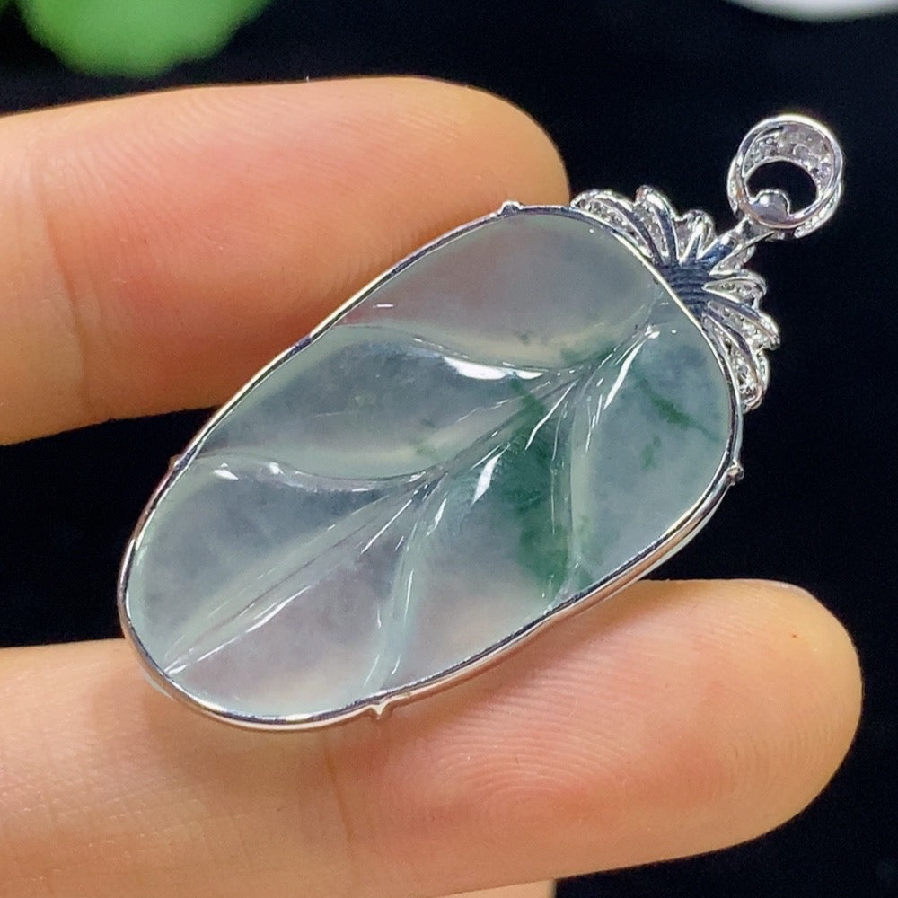 Jadeite leaf pendant with 18k gold and diamond accents, crafted by HUILIU HQ, featuring detailed leaf design and elegant sparkle.