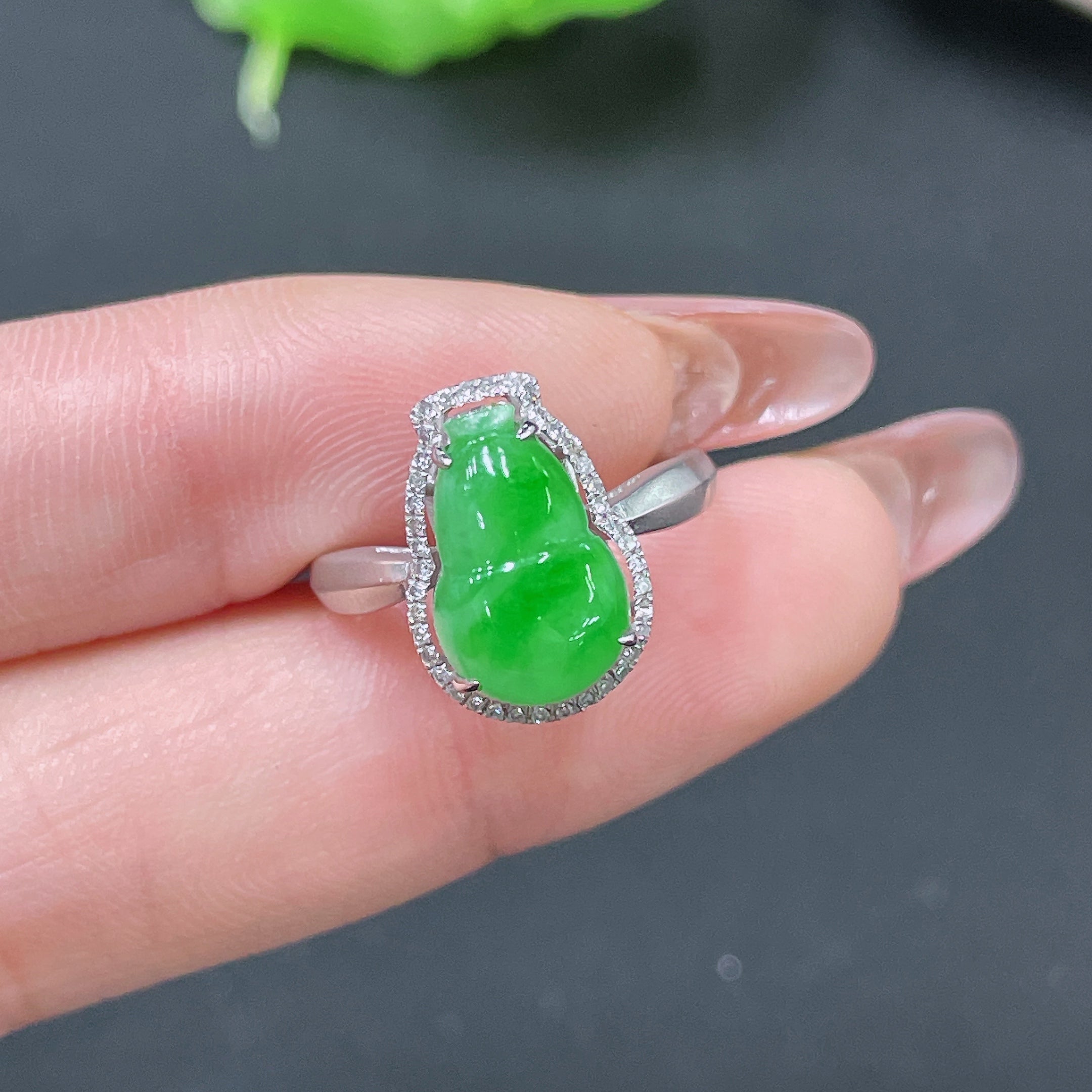 HUILIU HQ Jadeite ring with 18k gold setting and diamond accents, size 11, weighs approximately 2.75g.