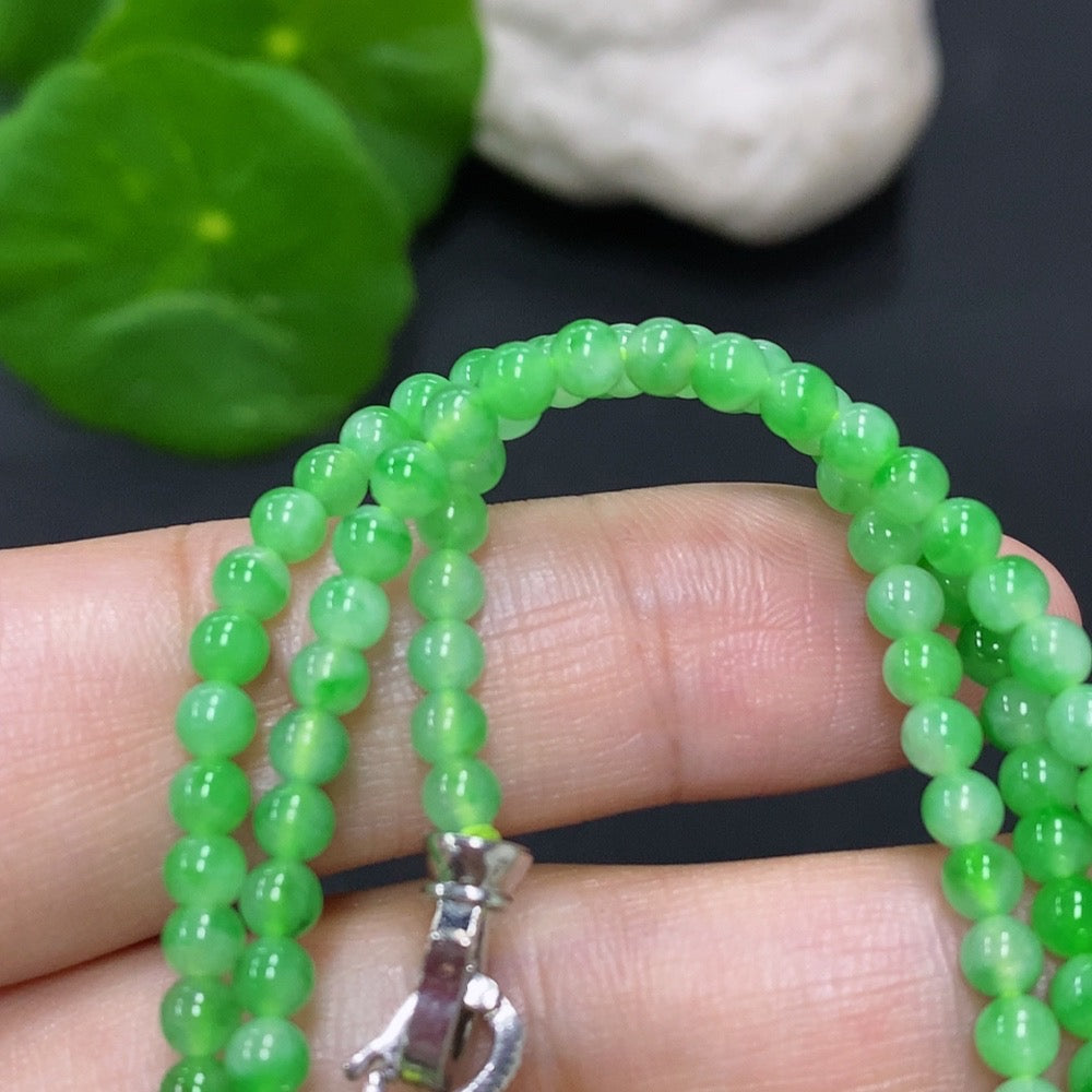 Jadeite bead necklace with 3.4mm jade beads, non-gold, weighing approximately 11.7g, featuring a string of smooth, green jade beads.