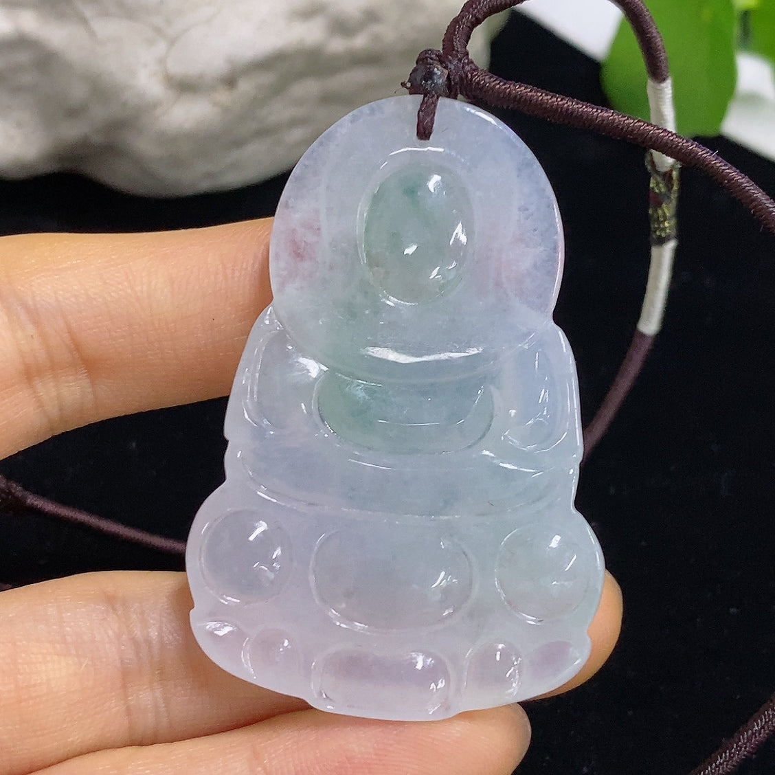 Jadeite Guanyin pendant with detailed carving, weighing approximately 21.6g including rope, crafted by HKHQ.