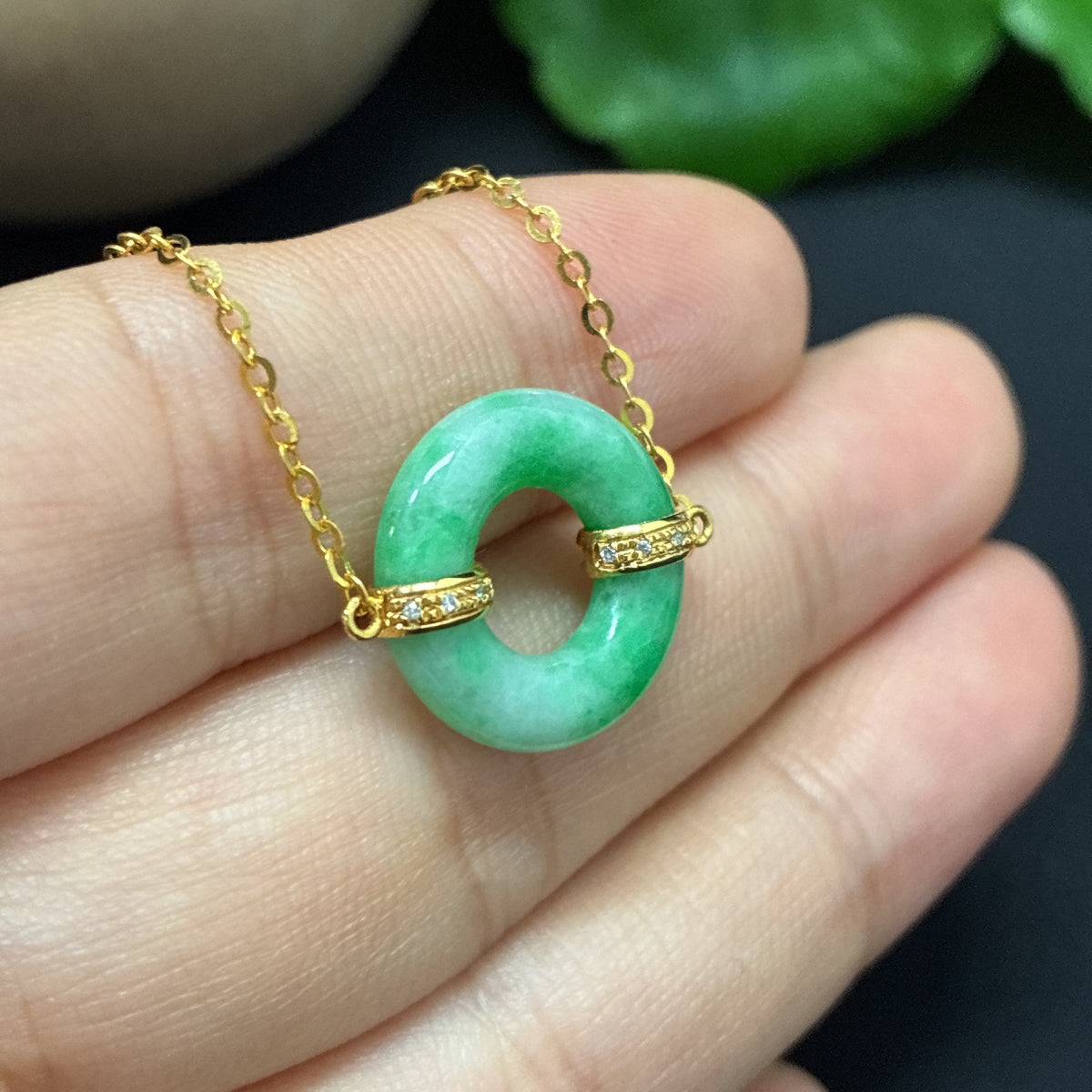 Jadeite inlaid bracelet with diamonds, 18K gold, showing intricate jade and diamond details on a delicate jewelry piece