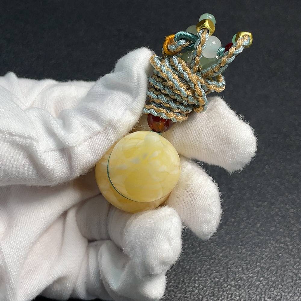 HUILIU HQ Amber beeswax pendant with rope, handcrafted, natural amber jewelry, certified by HUILIU HQ.