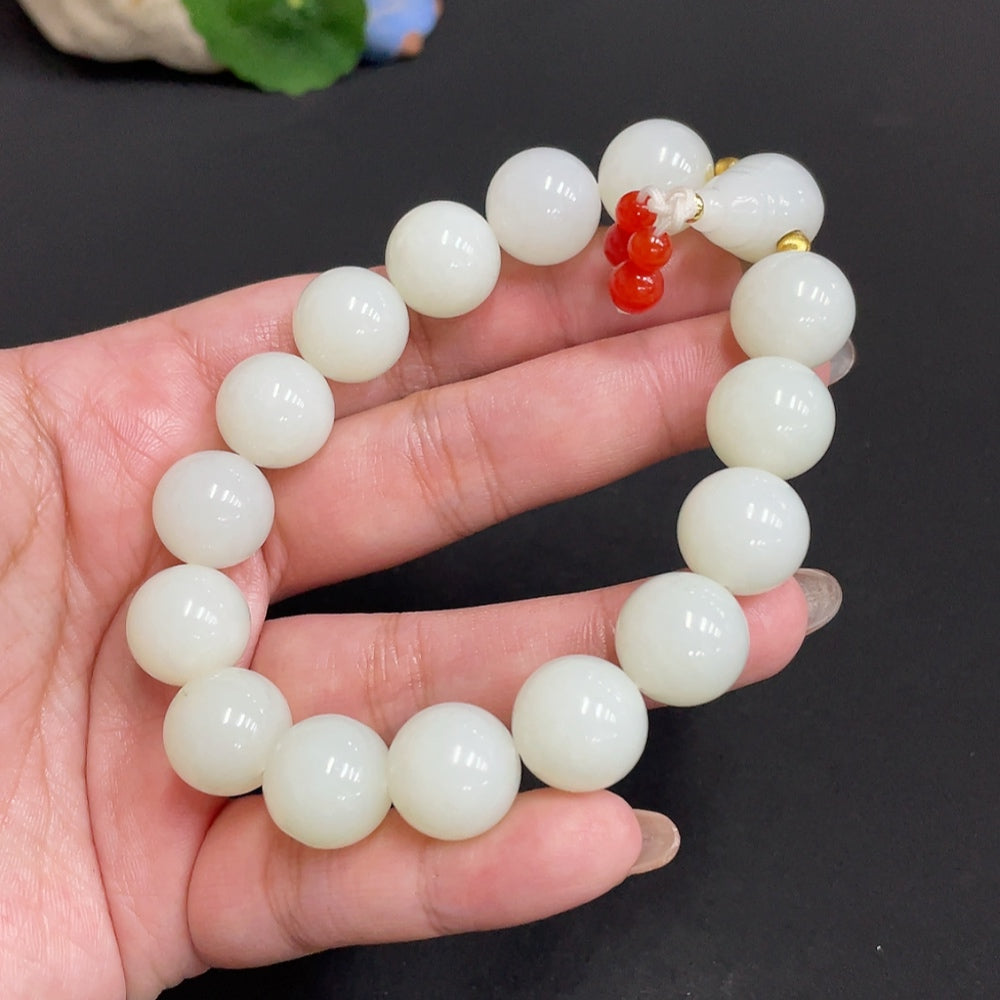 Huiliu certified Hetian jade bracelet with 13.8mm jade beads and mineral components, natural and polished appearance