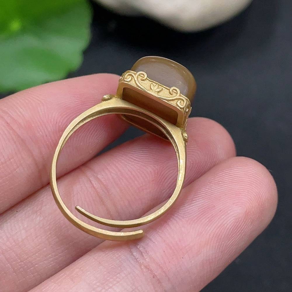Hetian jade open-ended ring by HUILIU HQ with 18k gold accents and diamond details, featuring a smooth, polished jade surface.