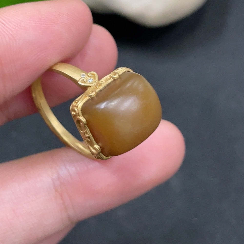 Hetian jade open-ended ring by HUILIU HQ with 18k gold accents and diamond details, featuring a smooth jade surface and elegant design.