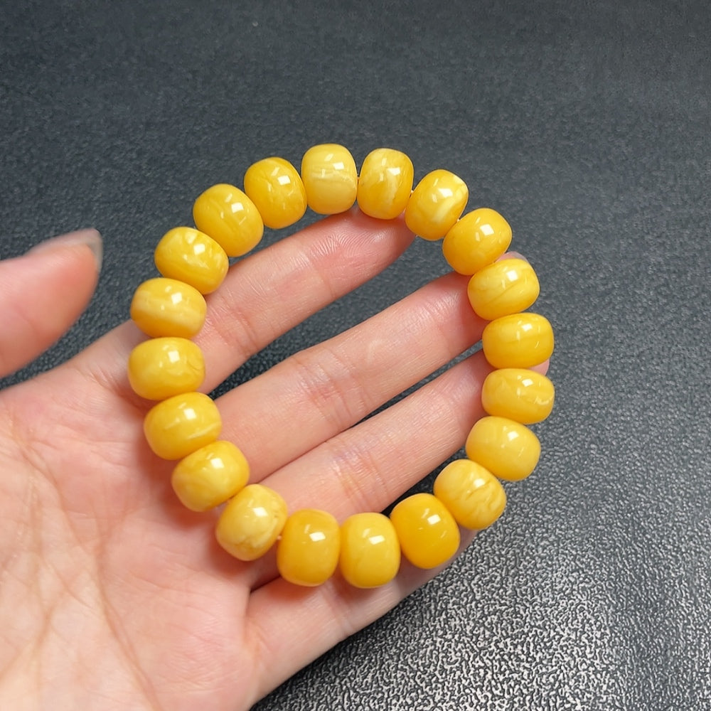 Huiliu Amber Beeswax bracelet with 12.4mm beads, natural amber color, crafted by HUILIU HQ for a stylish jewelry accessory.