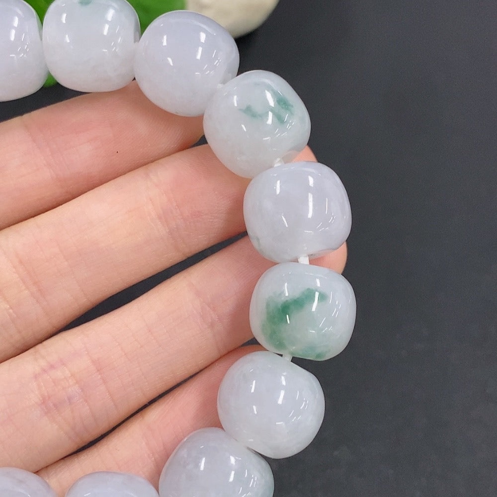 HKHQ jadeite bracelet weighing 83.3g, featuring smooth, polished jadeite beads strung together in a stylish bracelet design