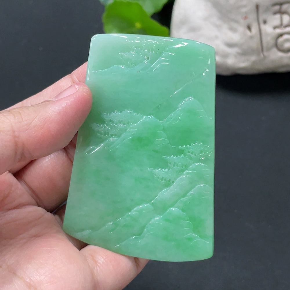 Huiliu Jadeite landscape pendant featuring detailed carved natural jade, approximately 2 inches tall, on a cord necklace.