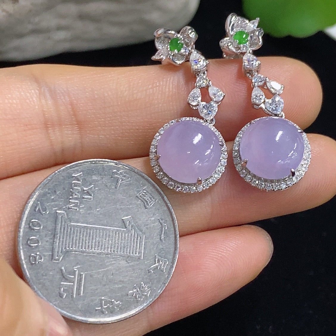 HKHQ jadeite cabochon earrings with 18K gold setting, elegant jewelry featuring smooth, polished green jade stones.