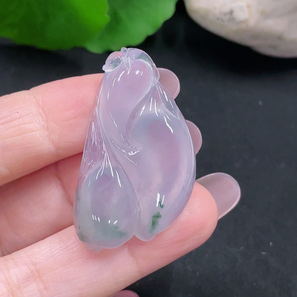 Huiliu Certified Jadeite pendant featuring a polished green jade gemstone on a delicate cord.