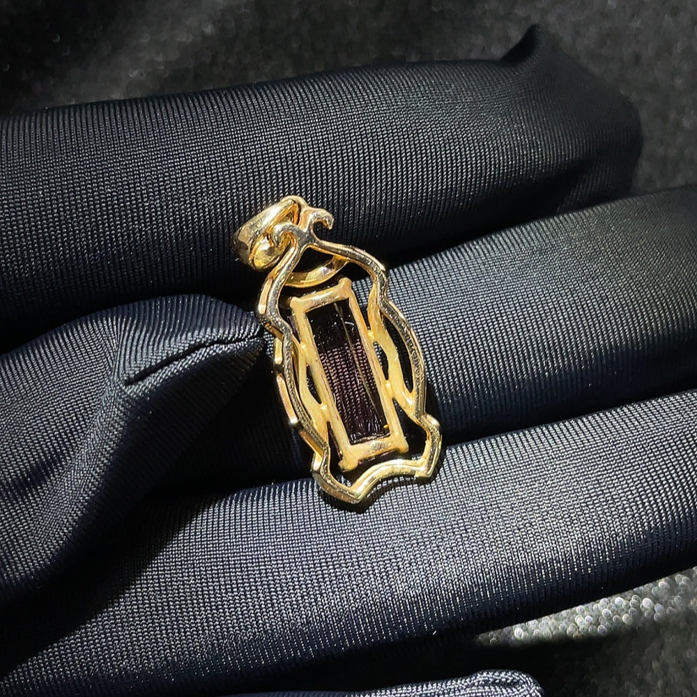 Tourmaline inlaid pendant featuring 18k gold, gemstone jewelry, HKHQ brand, showcasing the detailed gemstone setting.