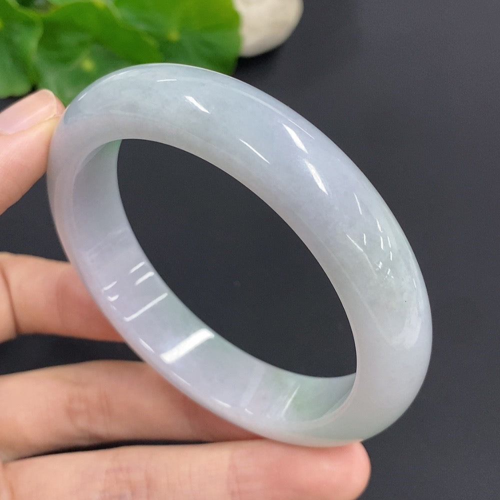 HKHQ jadeite round bangle, 61.2g, size 57, smooth green jade jewelry, showcasing polished, rounded design.
