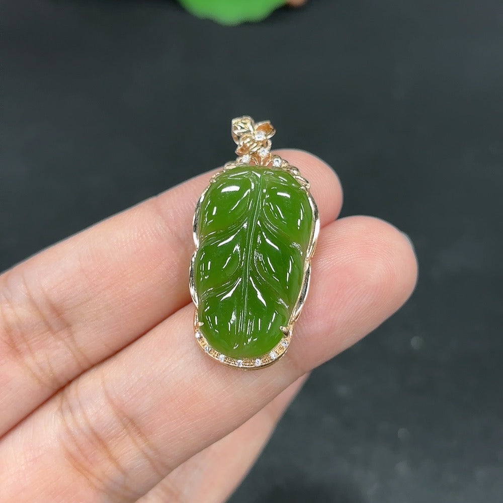 Green Hetian Jade inlaid pendant necklace from HKHQ featuring intricate craftsmanship and a polished, elegant design.