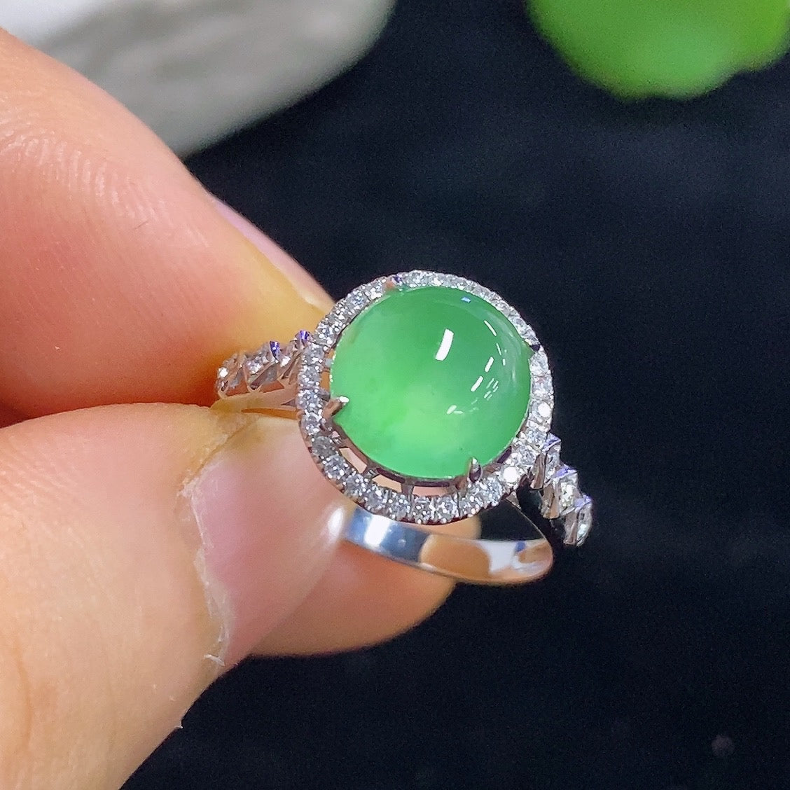 HKHQ jadeite cabochon ring with inlaid design, 18K gold band featuring diamond accents, elegant jewelry piece