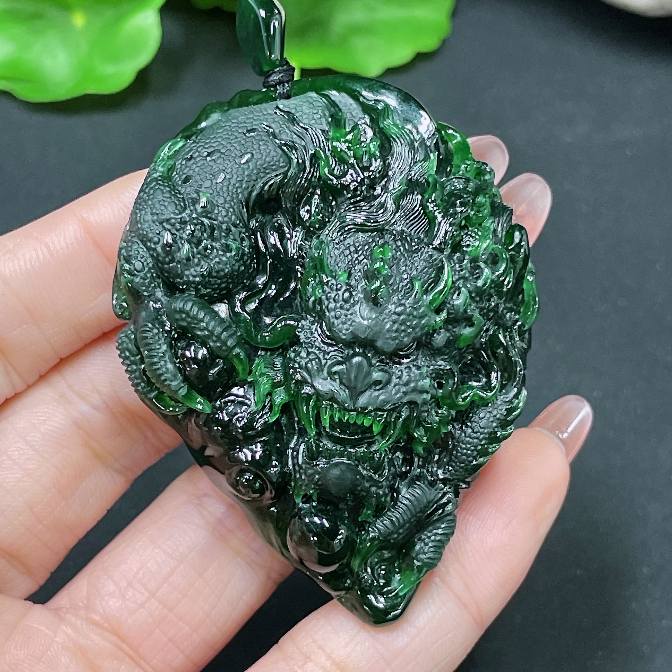 Jadeite pendant featuring a carved dragon plaque, crafted from green jade, weighing approximately 49.58g, by HUILIU HQ.