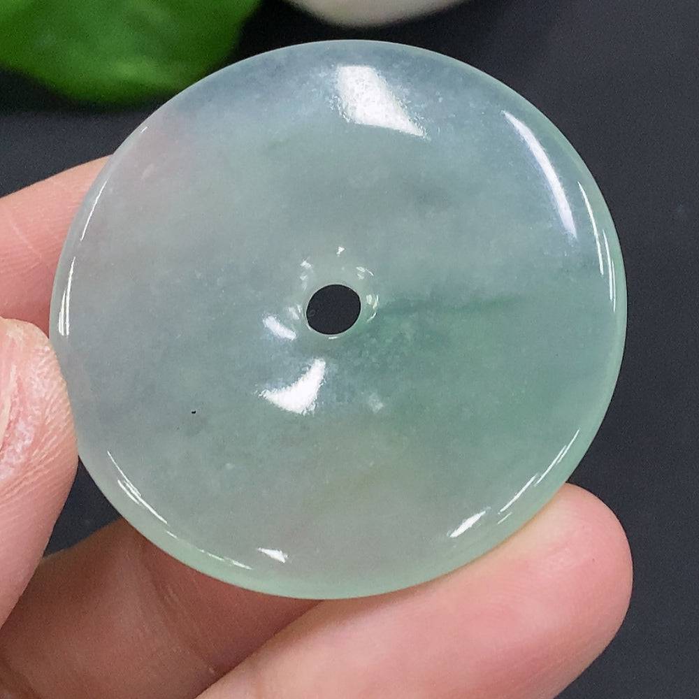 Jadeite Peace Knot pendant from HUILIU HQ, approximately 17.4 grams, featuring a polished jade knot design on a smooth surface.
