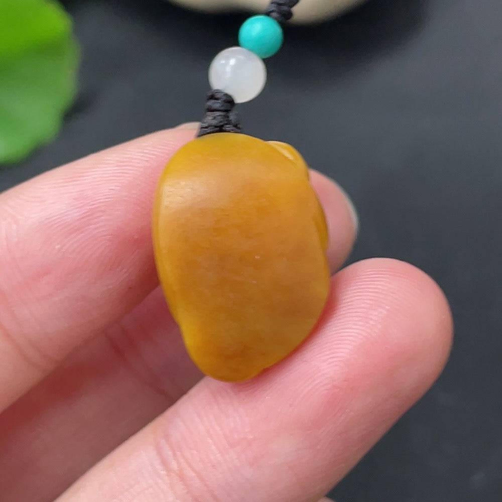 Huiliu Hetian jade pendant featuring a spirit monkey design with non-Hetian jade beads and a rope for wearing.