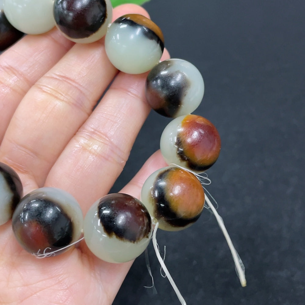 HKHQ Hetian Jade bracelet with 15.5mm beads, approximately 83g, natural skin tone, showcasing smooth, polished jade stones.