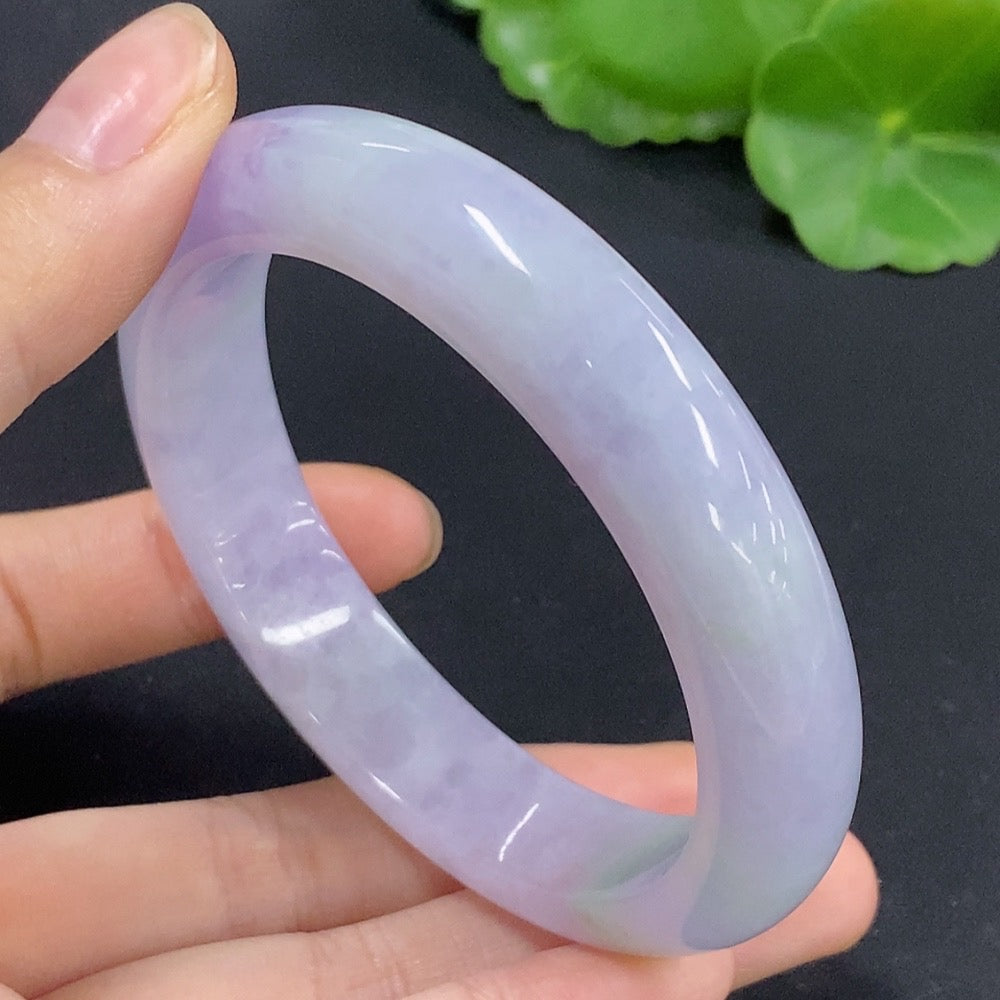 Jadeite round bangle in size 56.7, weighing approximately 58.98g, featuring smooth polished surface and rich green color.