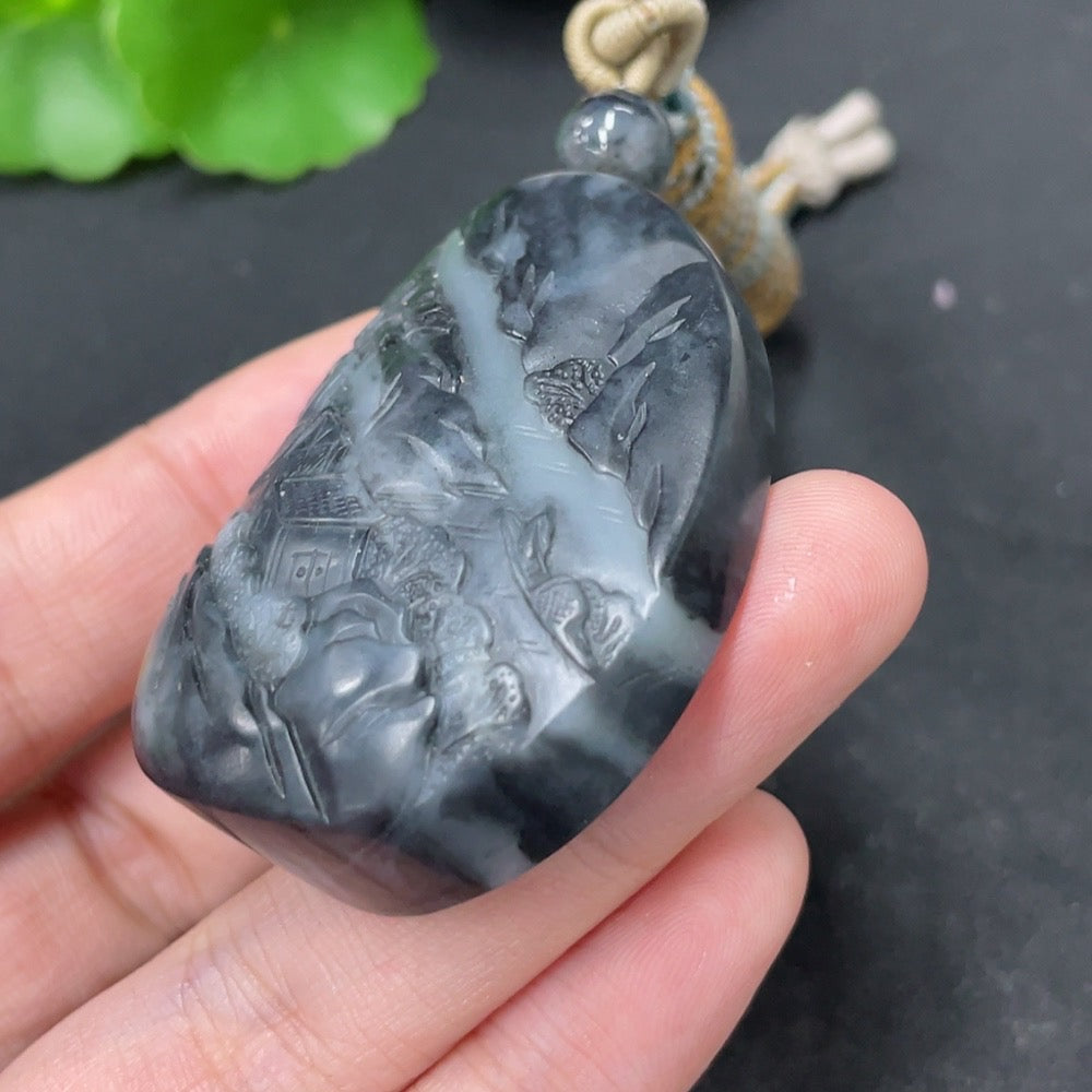 HKHQ Hetian jade pendant with landscape design, weighing approximately 54g including rope, showcasing smooth undetermined skin tone.