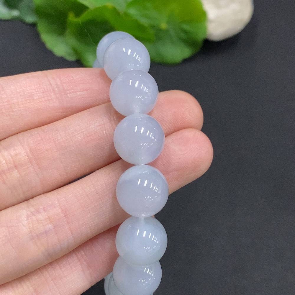HUILIU HQ jadeite bracelet, 12mm wide, approximately 50.3g, showcasing smooth jade stones and elegant craftsmanship.