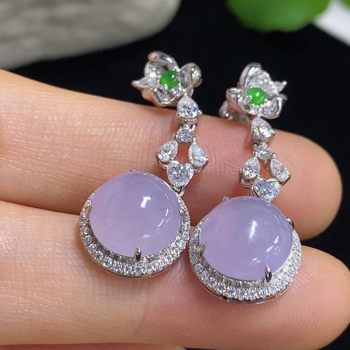 HKHQ jadeite cabochon earrings with 18K gold setting, showcasing smooth, polished jadeite stones in a stylish earring design.