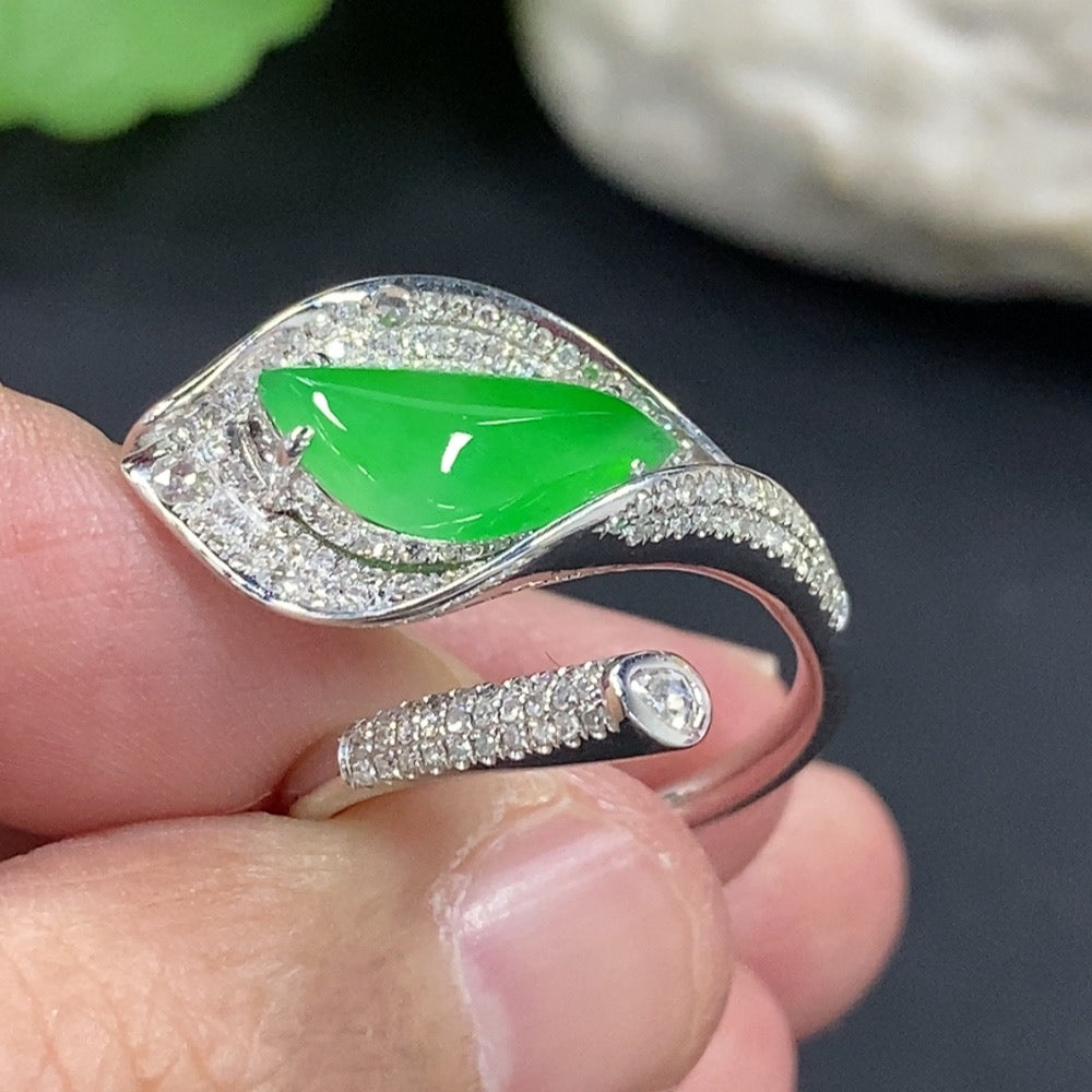 Jadeite freeform inlaid ring with 18K gold band and diamond accent, designed by HKHQ, showcasing elegant craftsmanship.