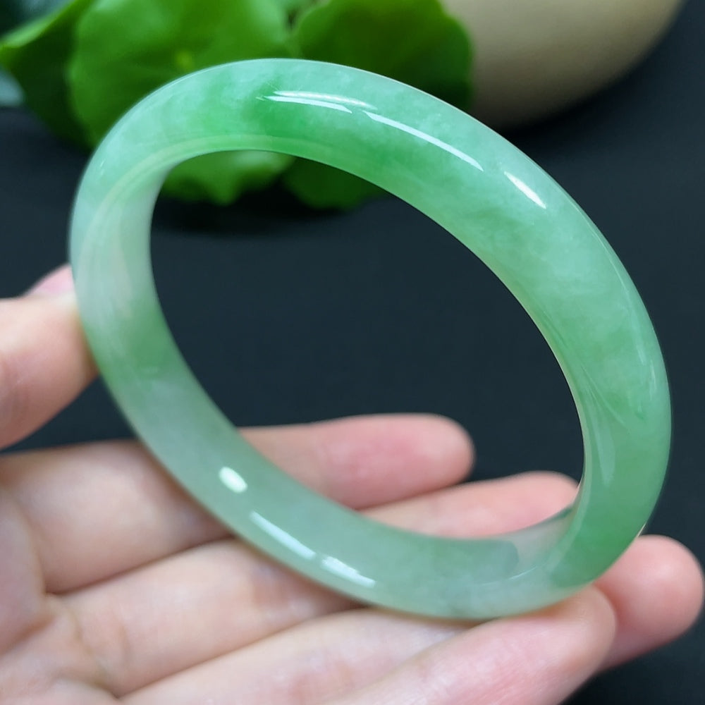 HKHQ jadeite round bangle, size 54.7, weighing 37.95g, showcasing smooth, polished jadeite with a glossy finish.