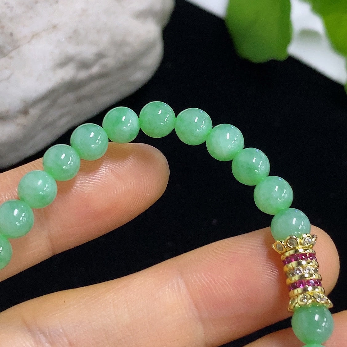 Jadeite bracelet with 5.6mm jade beads from HKHQ, non-gold, weighing approximately 11.96g, featuring smooth, polished jade stones.